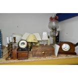 A GROUP OF BEDSIDE LAMPS, WOODEN BOXES AND A MANTEL CLOCK, comprising a Victorian oil lamp with a