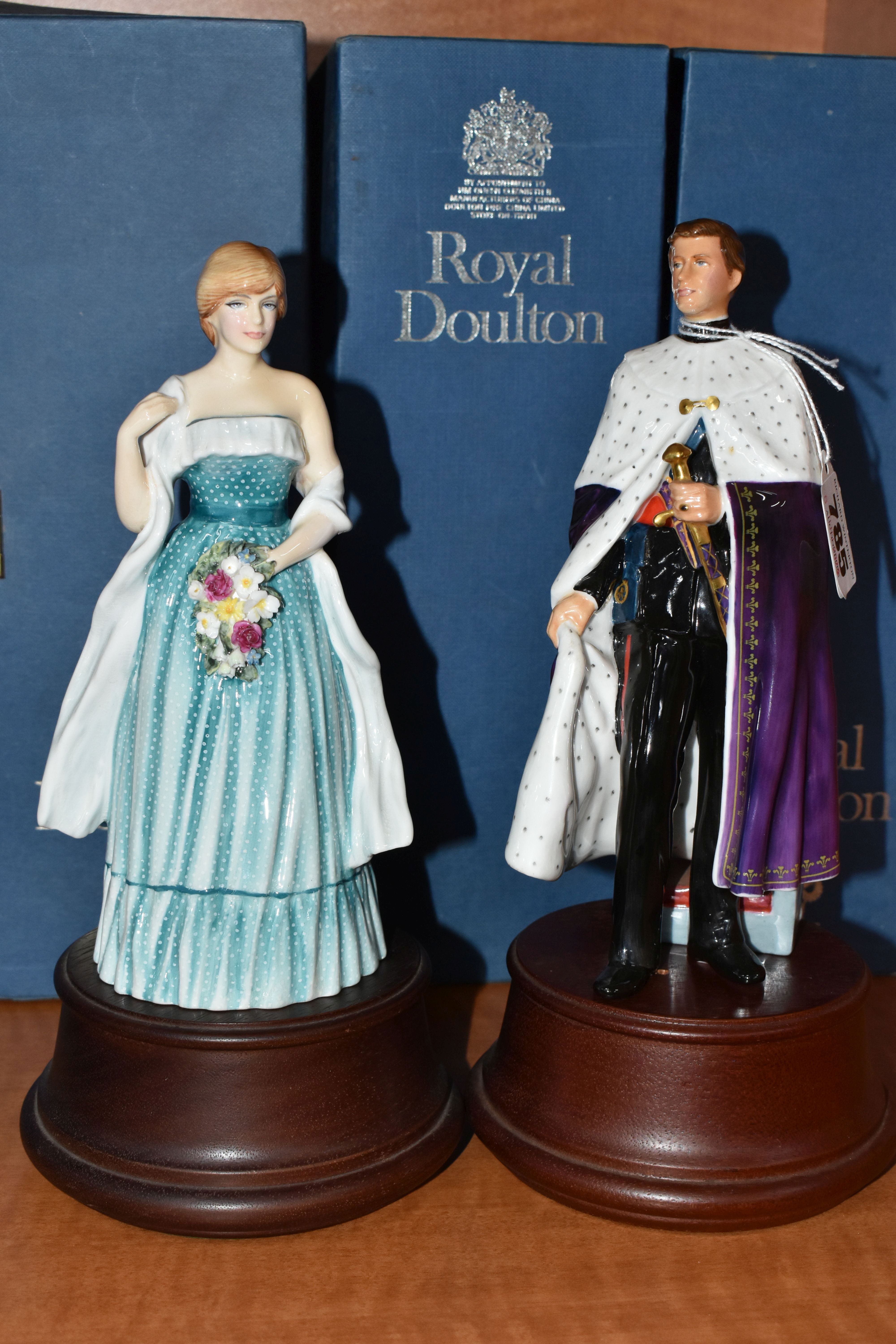 TWO BOXED ROYAL DOULTON FIGURINES, comprising HRH The Prince of Wales HN2883, numbered to base 217/