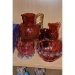 A GROUP OF CRANBERRY GLASS, comprising a graduating clear to pink jug, with amber glass handle and