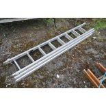 AN ALUMINIUM TRIPLE EXTENTION LADDER, labelled Lyte Int to side, each section length 220cm
