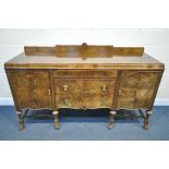 AN EARLY 20TH CENTURY BURR WALNUT SIDEBOARD, with raised back, cupboard doors flanking three drawers