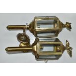 A PAIR OF BRASS ELECTRIC WALL LIGHTS, in the style of Victorian coach/carriage lanterns with brass