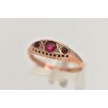 AN EARLY 20TH CENTURY, 9CT ROSE GOLD RUBY AND DIAMOND BOAT RING, set with three circular cut