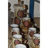 A FIFTEEN PIECE STUDIO POTTERY COFFEE SERVICE BY BRIGLIN POTTERY, with flower design, comprising a