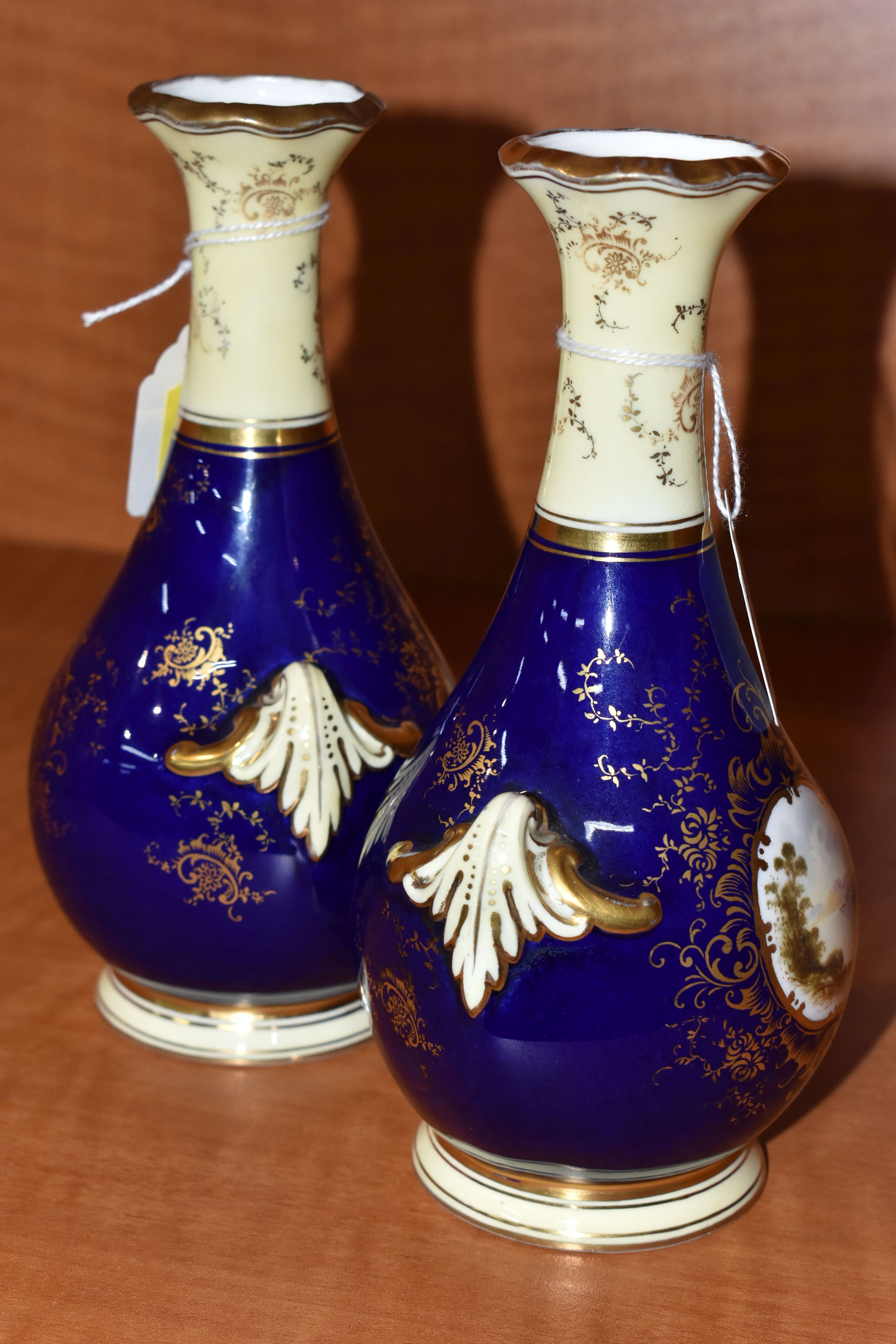 A PAIR OF EARLY 20TH CENTURY COALPORT BALUSTER VASES, blue, pale yellow and gilt ground, each hand - Image 4 of 8