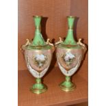 A PAIR OF LATE 19TH / EARLY 20TH CENTURY TWIN HANDLED BALUSTER VASES, the green, gilt, ivory and