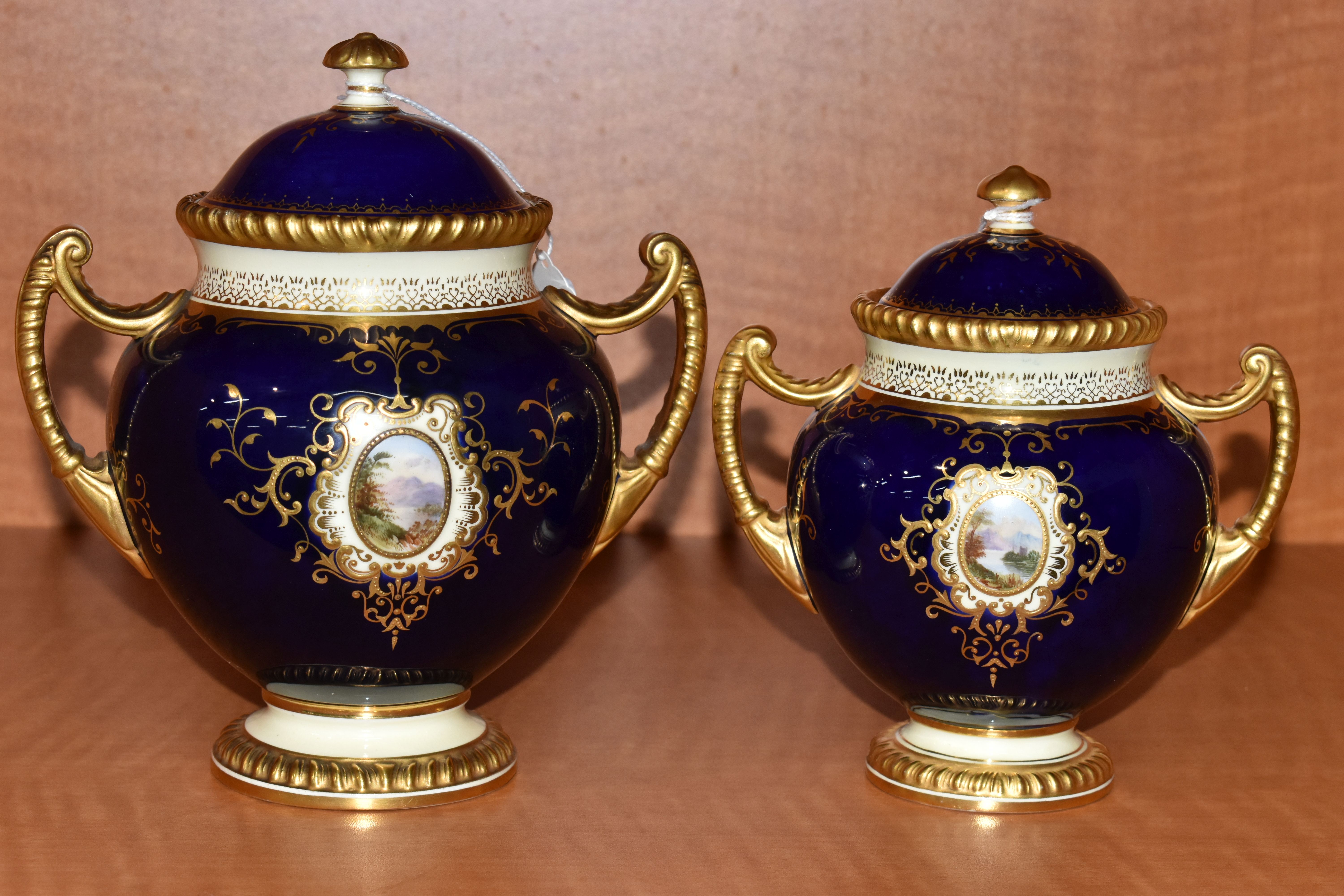 TWO EARLY 20TH CENTURY COALPORT TWIN HANDLED VASES AND COVERS, blue, pale yellow and gilt ground, - Image 5 of 12