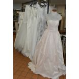 A GROUP OF WEDDING DRESSES, retail stock clearance, assorted styles to include princess line, A