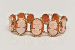 A 9CT GOLD, CAMEO BRACELET, designed as a series of eleven oval carved shell cameos, each