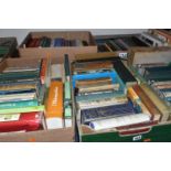 SEVEN BOXES OF BOOKS containing approximately 200+ titles in hardback and paperback format, subjects