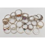 AN ASSORTMENT OF WHITE METAL RINGS, twenty three rings of assorted designs, some stamped 925,
