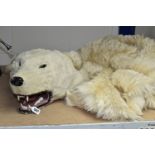 TAXIDERMY IN THE FORM OF A POLAR BEAR, glass eyes, nose damaged, wooden head, on a fabric lining (1)