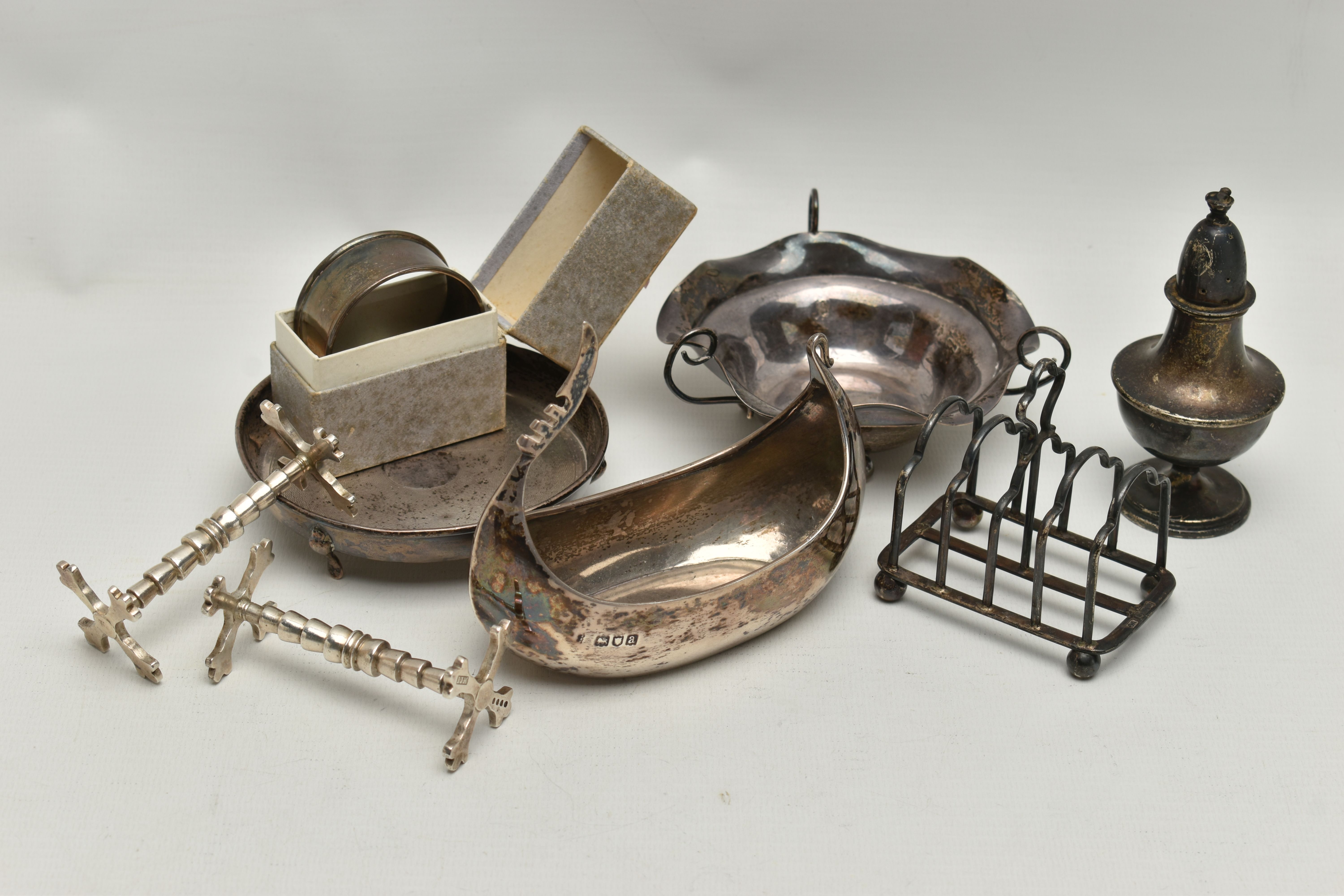 A PARCEL OF SILVER ITEMS, to include two early Victorian knife rests, hallmarked 'John James