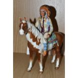 A BESWICK MOUNTED INDIAN, MODEL NO. 1391 (Condition Report: horse's ears, one moccasin shoe have