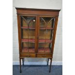 AN EDWARDIAN MAHOGANY AND INLAID TWO DOOR DISPLAY CABINET, enclosing two shelves, above two drawers,