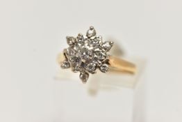 AN 18CT GOLD DIAMOND CLUSTER RING, flower shape cluster ring set with a central round brilliant