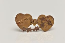 A YELLOW METAL SWEETHEART BROOCH, designed as two hearts with a bow and ivy leaf detail,