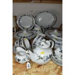 A ROYAL DOULTON 'BURGUNDY' PATTERN DINNER SET, comprising two circular covered tureens (one has a