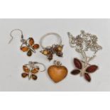 AN ASSORTMENT OF WHITE METAL JEWELLERY, to include an amber pendant, a pair of copal amber earrings,