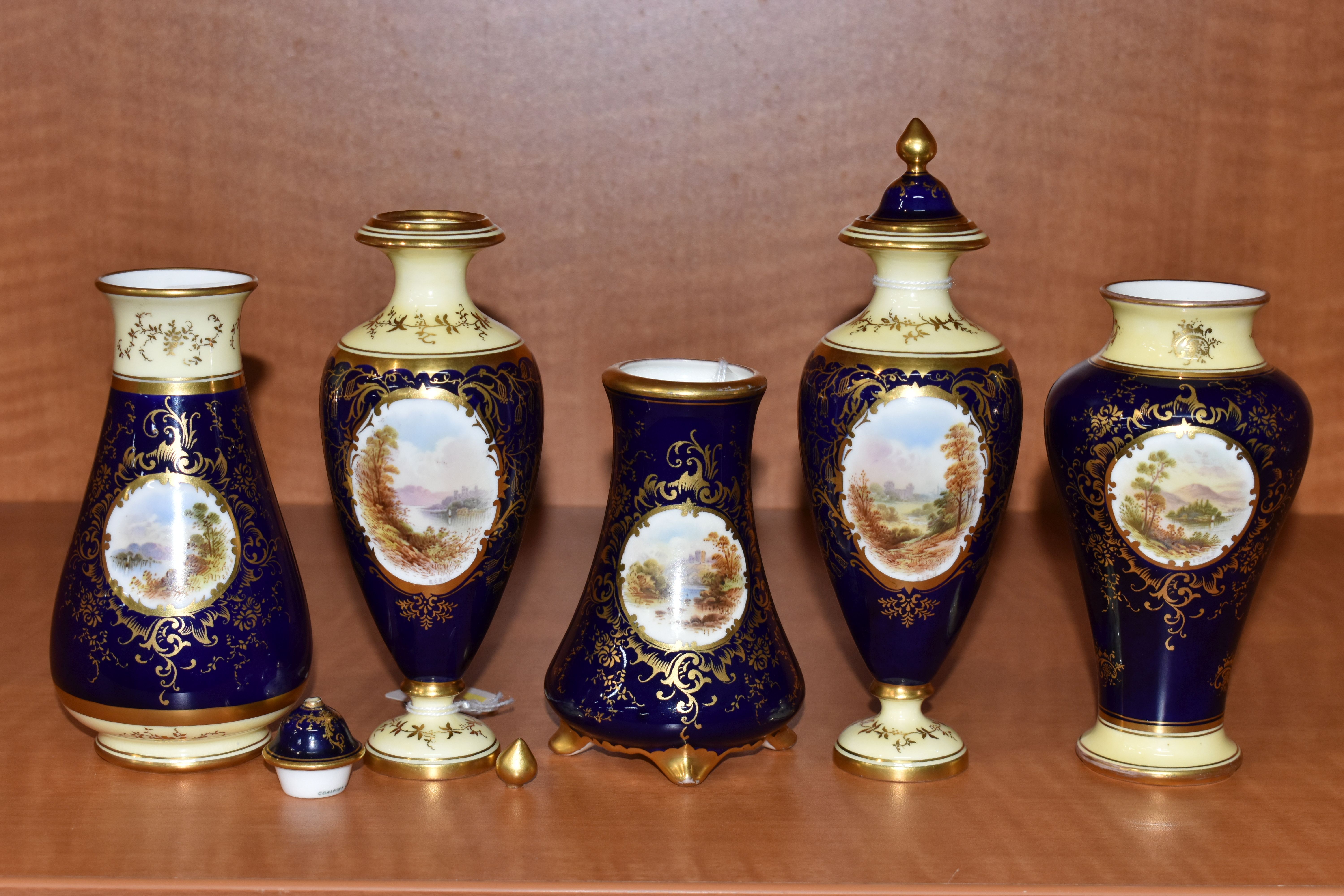 FIVE EARLY 20TH CENTURY COALPORT VASES, all blue and gilt ground, four with pale lemon borders,