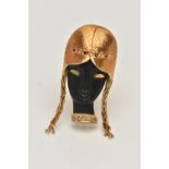 AN 18CT GOLD BLACKAMOOR STYLE BROOCH, depicting a front profile of a lady, headband set with a row