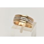 A 9CT GOLD WIDE BAND RING, bi-colour wide band, set with a row of channel set single cut diamonds,