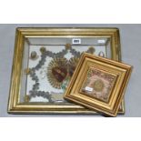 TWO FRAMED VICTORIAN RELIQUARY STYLE PICTURES, comprising a small gilt frame, containing a border of