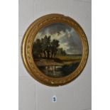 A TORQUAY TERRACOTTA HAND PAINTED WALL PLAQUE, depicting an impressionist style landscape with two