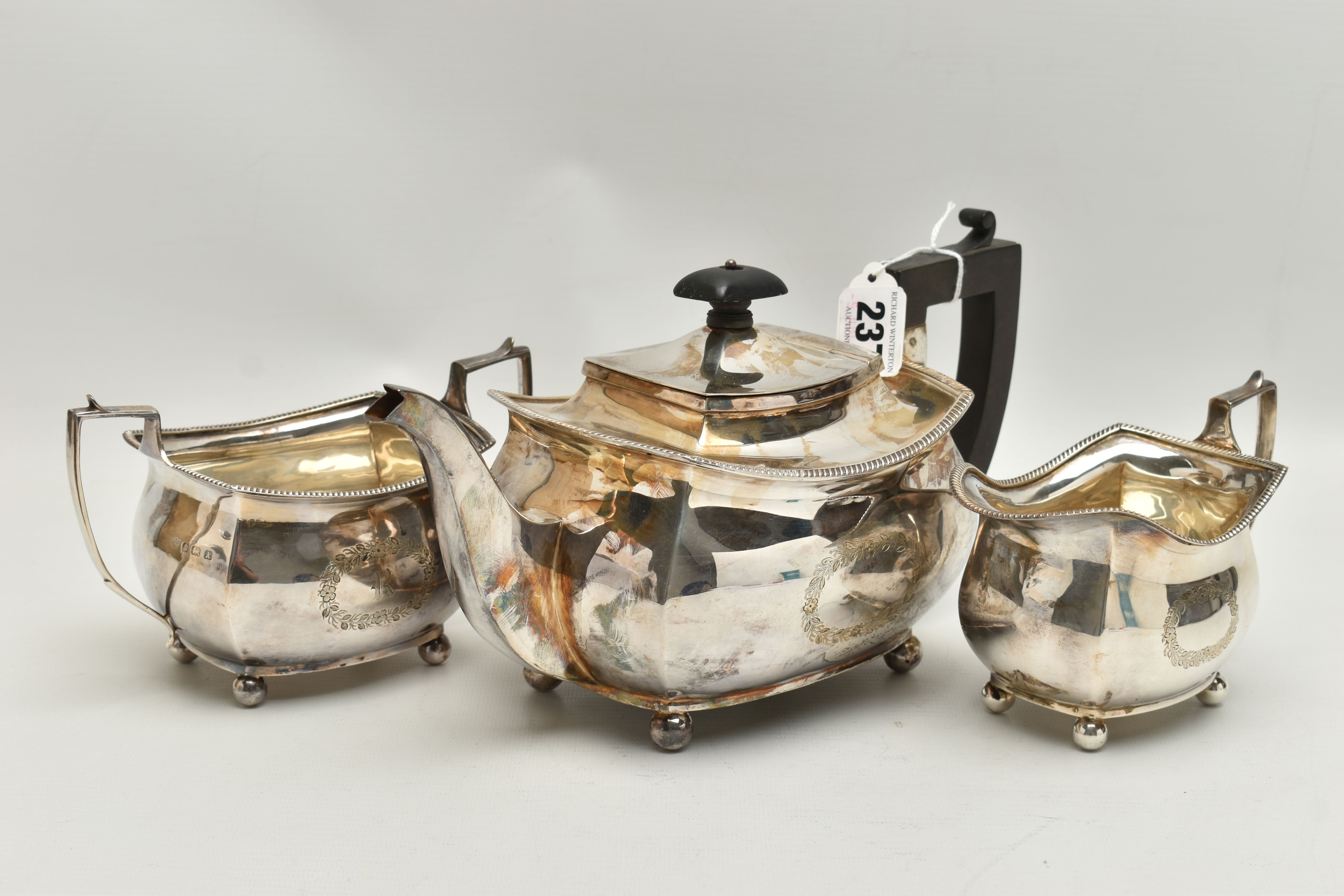 A GEORGE V THREE PIECE SILVER TEA SET, comprising of a polished teapot with engraved initial 'R' - Image 6 of 7