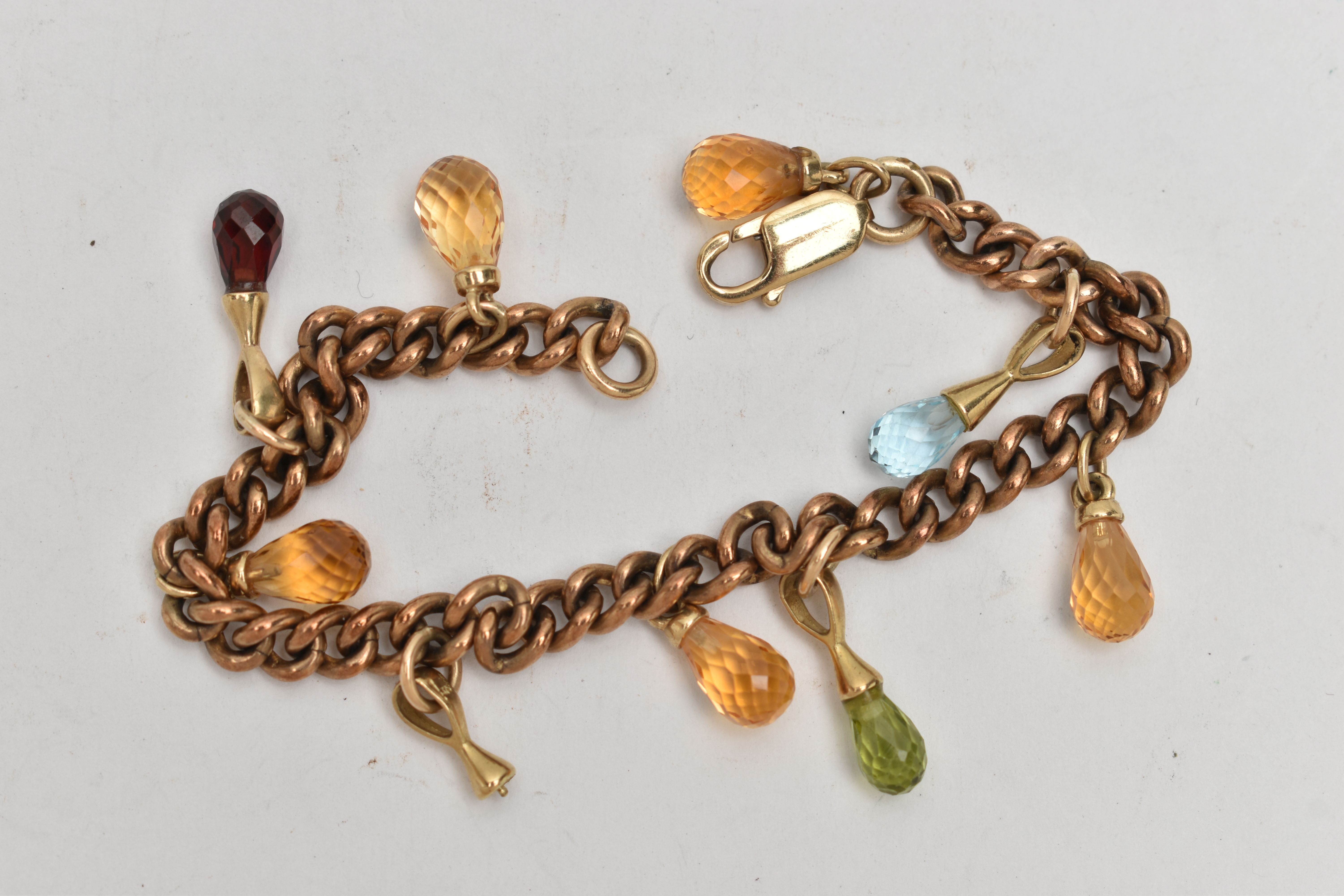 A YELLOW METAL GEM SET BRACELET, a rose metal curb link bracelet, fitted with eight semi-precious