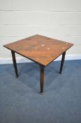 A HARWOOD TRIANGULAR GATE LEG TABLE, with a hinged compartment, open squared measurement 76cm x
