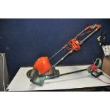 A FLYMO TURBO LITE 250 ELECTRIC LAWN MOWER and a Bosch Easi grass cut 23 strimmer (both PAT pass and