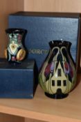TWO BOXED MOORCROFT POTTERY VASES, comprising a The Hamlet pattern baluster vase, tube lined with