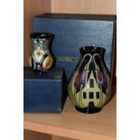 TWO BOXED MOORCROFT POTTERY VASES, comprising a The Hamlet pattern baluster vase, tube lined with