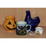 A GROUP OF MOORCROFT POTTERY, comprising a 'Bramble' design mug (cracked and crazed), a Pumpkin vase