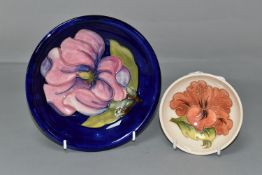 TWO MOORCROFT POTTERY BOWLS, comprising a small footed bowl, decorated in Coral Hibiscus pattern
