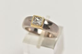 A YELLOW AND WHITE METAL SINGLE STONE DIAMOND RING, princess cut diamond collet set in a yellow