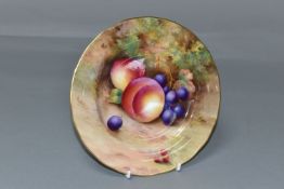 A ROYAL WORCESTER 'Fallen Fruits' design plate, decorated with peaches, grapes and berries, diameter