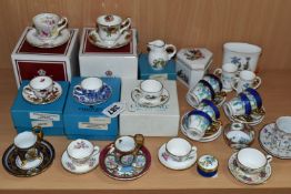 A COLLECTION OF MINIATURE CUPS AND SAUCERS, ETC, to include boxed teacups in Royal Albert Old