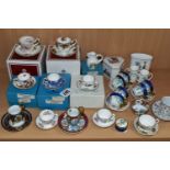 A COLLECTION OF MINIATURE CUPS AND SAUCERS, ETC, to include boxed teacups in Royal Albert Old