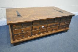 A LAURA ASHLEY GARRAT CHESTNUT STORAGE COFFEE TABLE, with twelve small drawers, width 118cm x