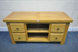 A SOLID LIGHT OAK TV STAND, with four drawers, width 123cm x depth 53cm x height 63cm (condition:-
