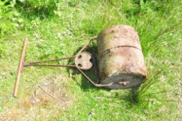 A VINTAGE 'IRONCRETE' GARDEN ROLLER with concrete roller and iron frame width 45 cm height 100cm
