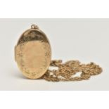 A 9CT GOLD LOCKET AND CHAIN, oval locket with floral detail to the front, opens to reveal two