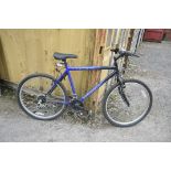 A DARK BLUE UNIVERSAL FUSION MENS BICYCLE, with an 18 inch frame, and falcon gears (condition -