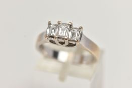 AN 18CT GOLD THREE STONE DIAMOND RING, the tiered design claw set with three millennium cut