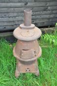 A 'SEARS CAST IRON CHIMENEA with flue, two doors and lid total height 100cm (these items are offsite