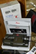 A CASED AND BOXED PAIR OF LEICA TRINOVID 10X25 BCA GREEN POCKET BINOCULARS, comes with receipt of