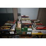 FOUR BOXES OF BOOKS containing approximately 120 titles in hardback and paperback formats on the