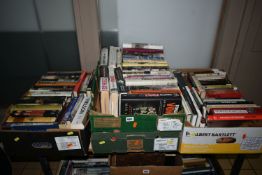 FOUR BOXES OF BOOKS containing approximately 120 titles in hardback and paperback formats on the